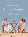 Fancy simple cookbook cover of two women eating a meal on the beach