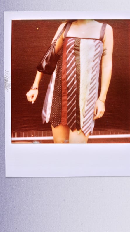 A Polaroid-style photograph shows a person from the shoulders down wearing a sleeveless mini dress made from assorted neckties in different colours and patterns.