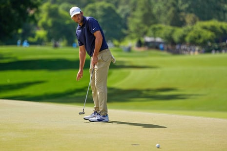 Scottie Scheffler reacts after missing a putt on the eighth hole.