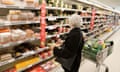 Elderly woman shopping for food in a supermarket