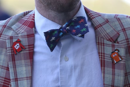 close up of a bowtie with horses on it