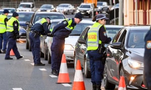 NSW police in the border city of Albury check cars crossing from Victoria on Wednesday after authorities closed the border due to an outbreak of Covid-19 in Melbourne.