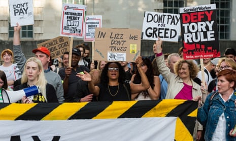 Demonstrators protest outside Downing Street against the government's handling of the cost of living crisis.