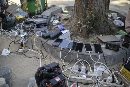 Phones being charged at a Palestinian Red Crescent centre.
