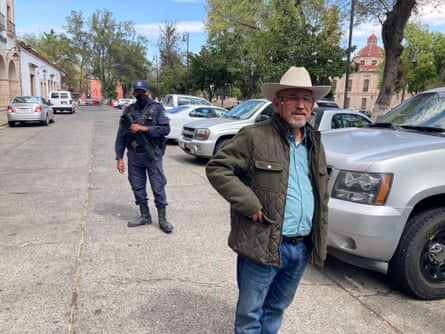 Hipólito Mora and one of his bodyguards in 2022 in Michoacán’s capital, Morelia.