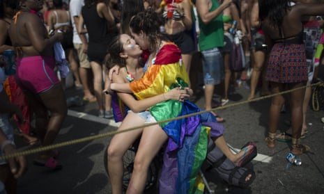 Two women kiss during the gay pride parade in Rio de Janeiro, Brazil, in 2016.