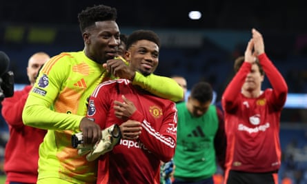 Amad Diallo of Manchester United celebrates at full-time with Andre Onana