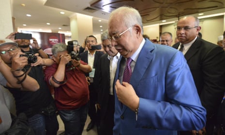 Malaysia’s former prime minister Najib Razak walks out of court in Kuala Lumpur after defending himself against corruption charges linked to the country’s 1MDB infrastructure fund.