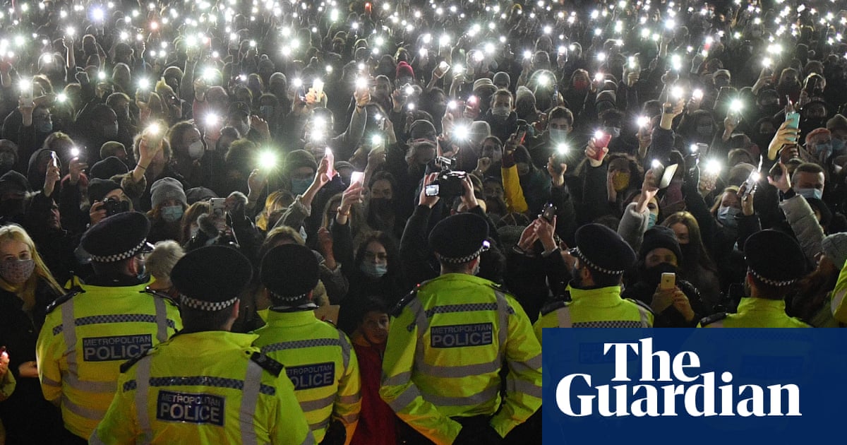 ‘Police are trying to silence us’: officers clash with mourners at Sarah Everard vigil – video