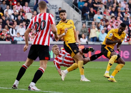 Brentford’s Ben Mee scores against Wolves.