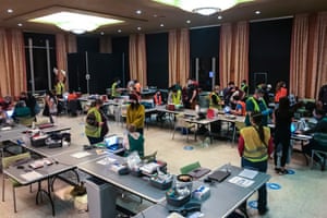 Healthcare workers rush to distribute Covid vaccines after a middle-of-the-night freezer failure in Seattle.