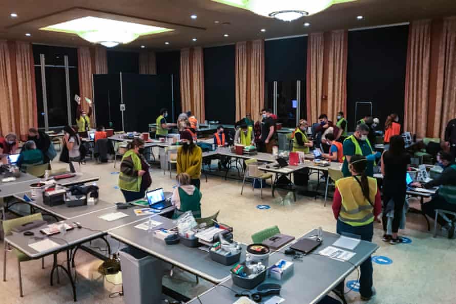 Healthcare workers rush to distribute Covid vaccines after a middle-of-the-night freezer failure in Seattle.