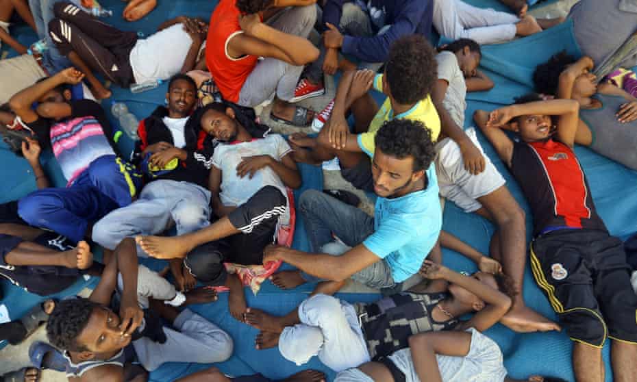 Migrants in the Ganzour shelter after being transferred due to fighting in the Libyan capital Tripoli