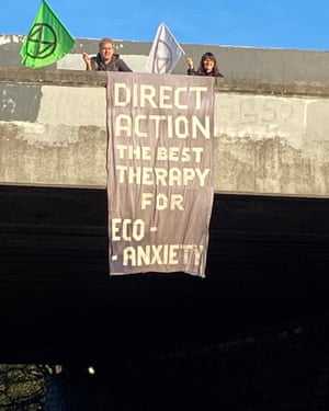 Cop26: Thousands of young activists march into Glasgow – day five live | Environment 7 Banner drop by Extinction Rebellion in London