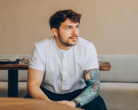 Eugene Korolev sits at a restaurant table