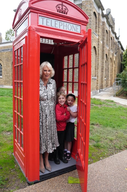 Camilla joins eight pupils from Dulwich Village infants’ school inside original telephone box during her visit to Dulwich Picture Gallery