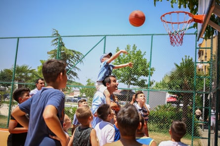 Erion Veliaj, Tirana’s mayor, playing basketball with local kids.