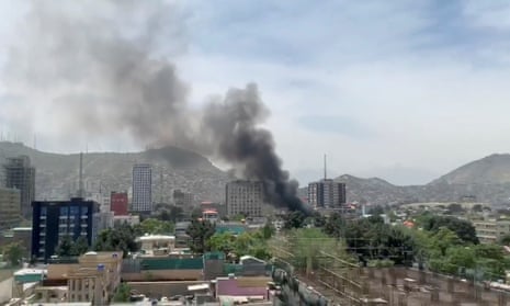 Smoke rises from an explosion in Kabul during the attack on Counterpart International’s Afghan headquarters