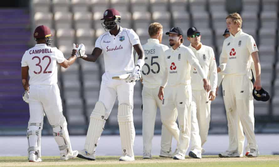 Jason Holder celebrates with John Campbell after West Indies beat England in the first Test at the Ageas Bowl on 12 July 2020.