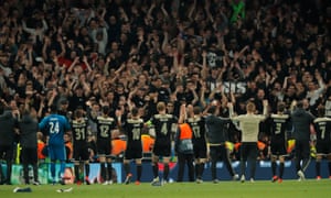 Ajax players celebrate with their fans after the final whistle.