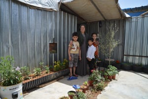 Naama Ibrahim and her children in their garden at Domiz refugee camp in Iraq.