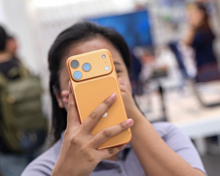 Apple hits $4tn market value as new iPhone models revitalize sales