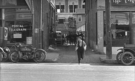 Buster Keaton runs out from the alley on to Cahuenga Boulevard in the 1922 film Cops.