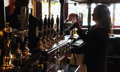A barmaid pulls a pint in a pub. Bar staff could also be helping drinkers take more care of their health better, according to the RSPH report. 