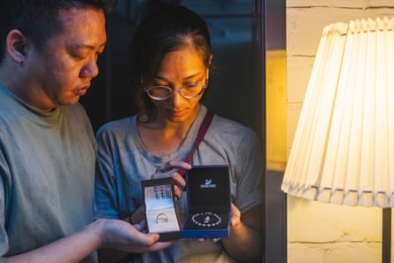 Yip Shun-Ting Carbon and his wife, Karen, display a ring and the Swarovski bracelet – a gift from his mother who died in the fire – recovered from their fire-ravaged flat at Wang Fuk Court.