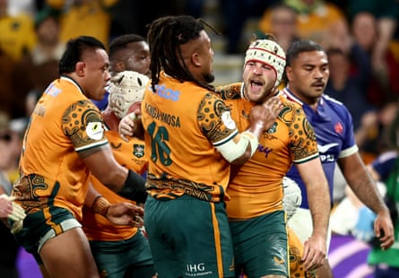 Fraser McReight celebrates scoring a try.