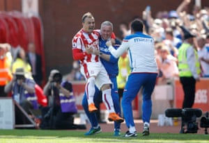 Shaqiri jumps onto manager Paul Lambert.