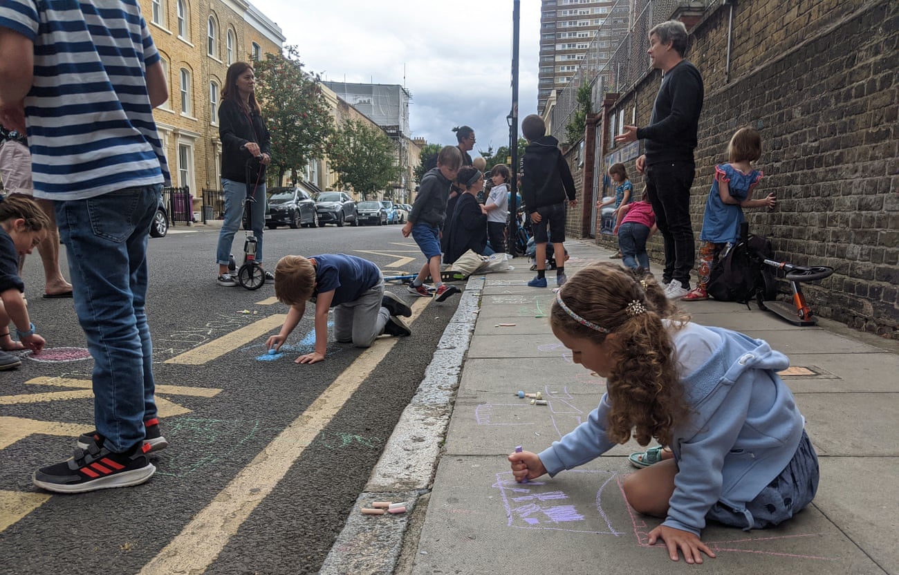 Street art … children and parents outside Chisenhale school in east London.