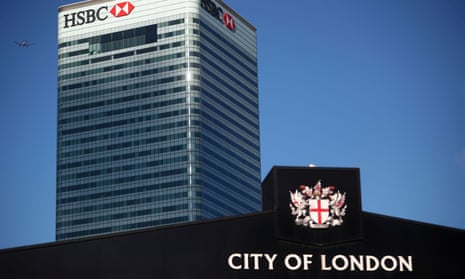 HSBC's building in Canary Wharf behind a City of London sign outside Billingsgate Market