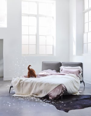 Park bed designed by Carlo Colombo for Poliform. Ivory silk sheet, vintage pink silk pillowcases and duvet cover, all from Gingerlily. Sheepskin in Natural, (Z579/02) from Zinc Textile.