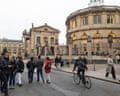Young people on street outside Oxford University buildings