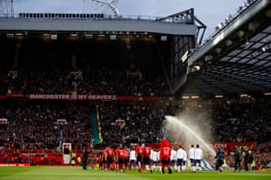 The teams come out at Old Trafford.