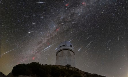 FILE - In this Dec. 14, 2023 photo provided by NOIRLab, meteors from the A Geminid meteor shower streaks across the sky above the Kitt Peak National Observatory in Arizona in 2023.
