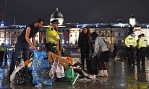 Protesters gather their belongings as police remove the last of the Extinction Rebellion demonstration in Trafalgar Square.