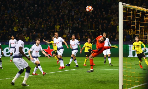 Hugo Lloris dives to deny Mario Götze a goal, as Dortmund were shut out by Spurs for a second time.