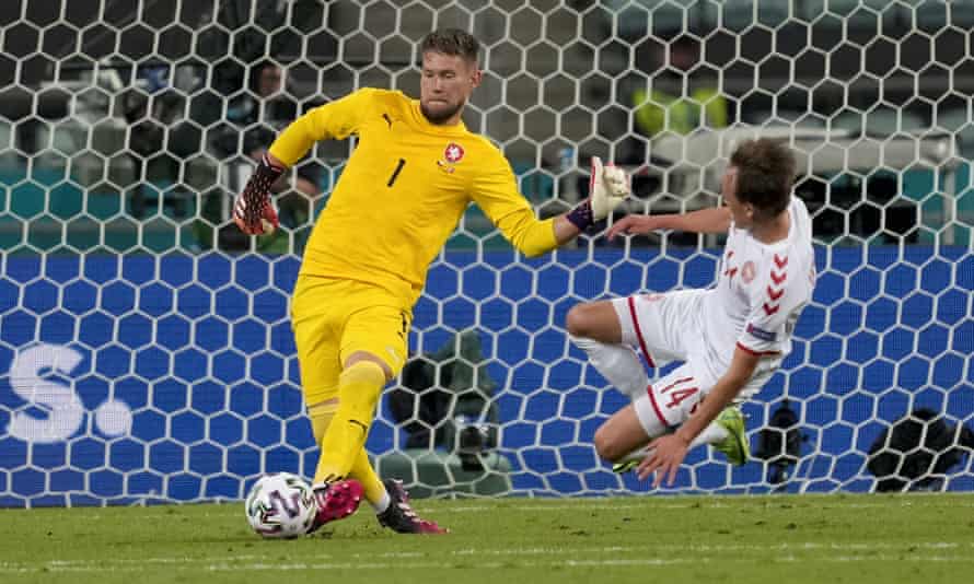 Czech Republic goalkeeper Tomas Vaclik clears the ball away from the challenge of Danish Mikkel Damsgaard.