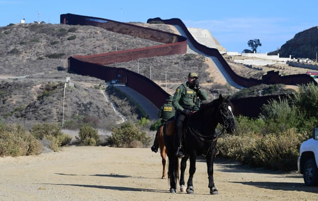police officer in front of wall
