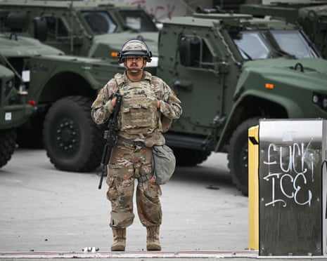 A member of the California Guard stands watch outside the Edward R. Roybal Federal Building.