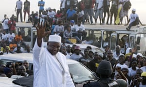 President Adama Barrow rides through crowds of supporters after arriving at Banjul airport in Gambia in January