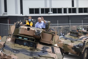 Prime Minister Scott Morrison takes a ride in a Combat Reconnaissance Vehicle during the opening of Rheinmetall Military Vehicle Centre of Excellence in Redbank, Queensland, Sunday, October 11, 2020.