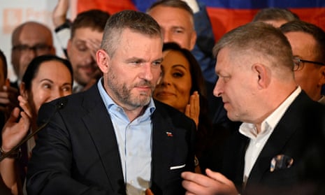 Slovakia’s new president, Peter Pellegrini (left), shaking hands with the country’s prime minister, Robert Fico, on the day of the election.