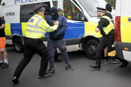 Police arresting a rioter in Rotherham