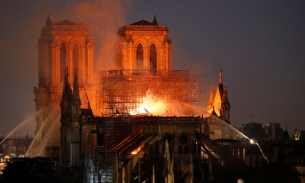 Flames and smoke billow from the cathedral roof in April 2019.