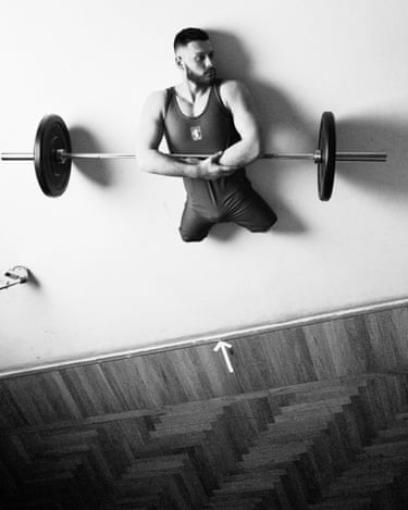 Donato Telesca (from the series Physique Du Rôle), 2024The image of Italian powerlifter Donato Telesca was taken in the run up to the Paris Paralympic Games in 2024, where Telesca won a bronze medal. Shot from above, the photograph incorporates deliberately imperfect elements in the composition – the metal wheel and the taped arrow. The portrait presents an image of order and strength, confounding and reconfiguring our expectation of disability