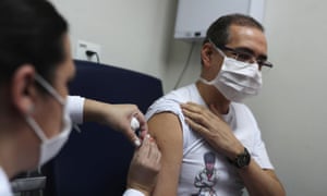 A nurse administers China’s SinoVac coronavirus potential vaccine to a volunteer in Sao Paulo.