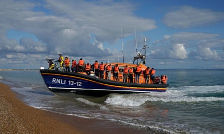 A group of people thought to be migrants are brought in to Dungeness, Kent. Under the government’s controversial plans they could be sent to Rwanda.